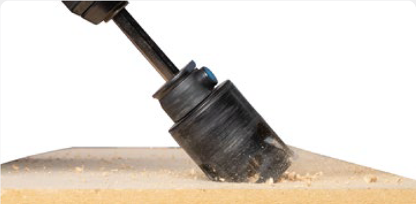 Lock cup back in arbor channel, re-insert bit/cup into cut and drill