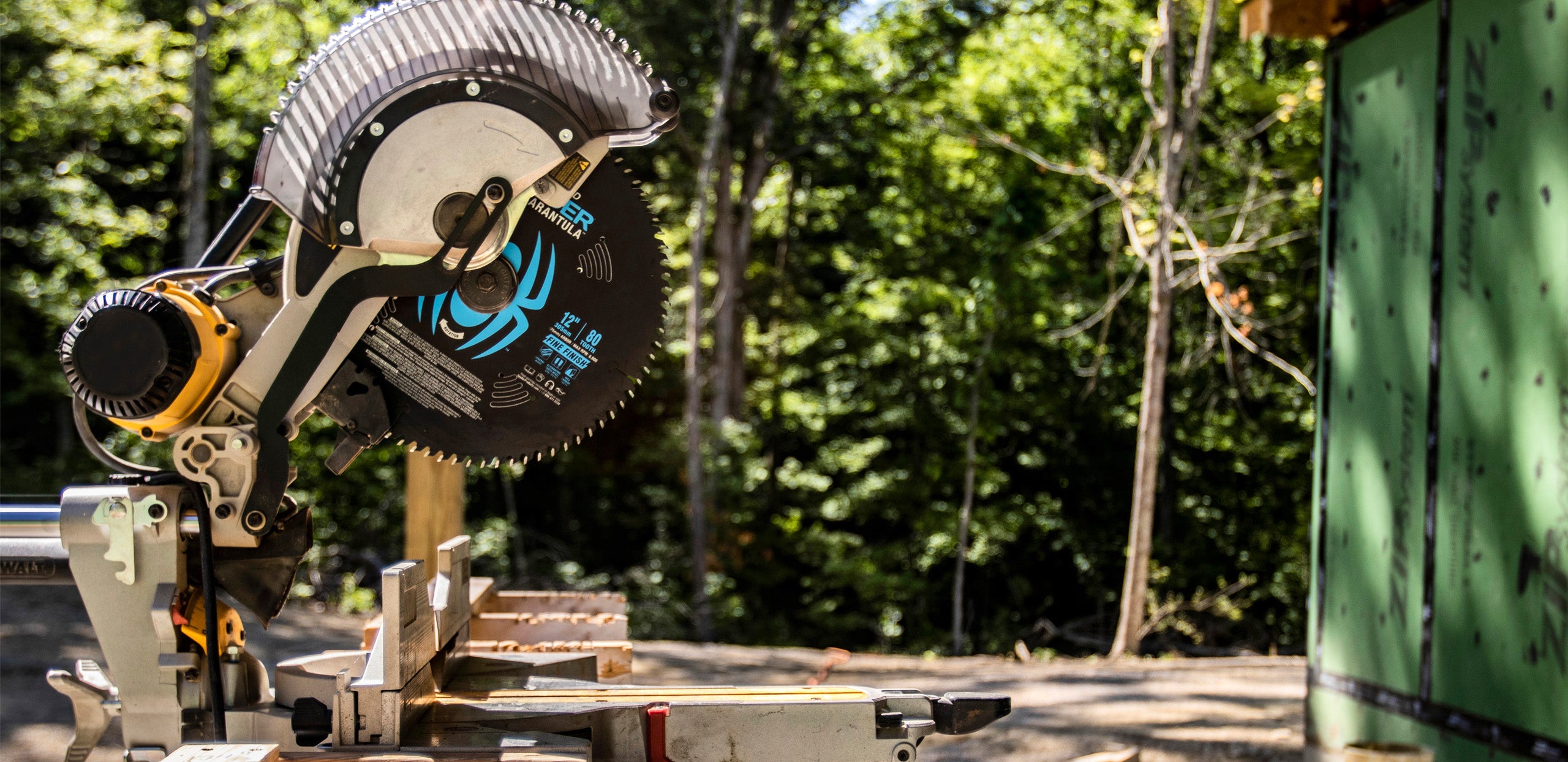 Circular saw in a forest setting with trees in the background