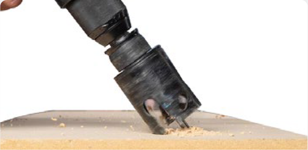 Slide cup back to the chuck and drill pilot hole until cup makes a cut