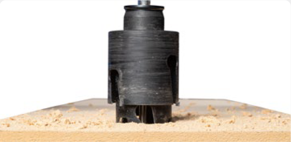 Drill hole, using the smaller/initial cup as the pilot—remove core
