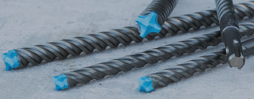 Blue Tipped Spyder® Concrete & Masonry bits on a concrete surface